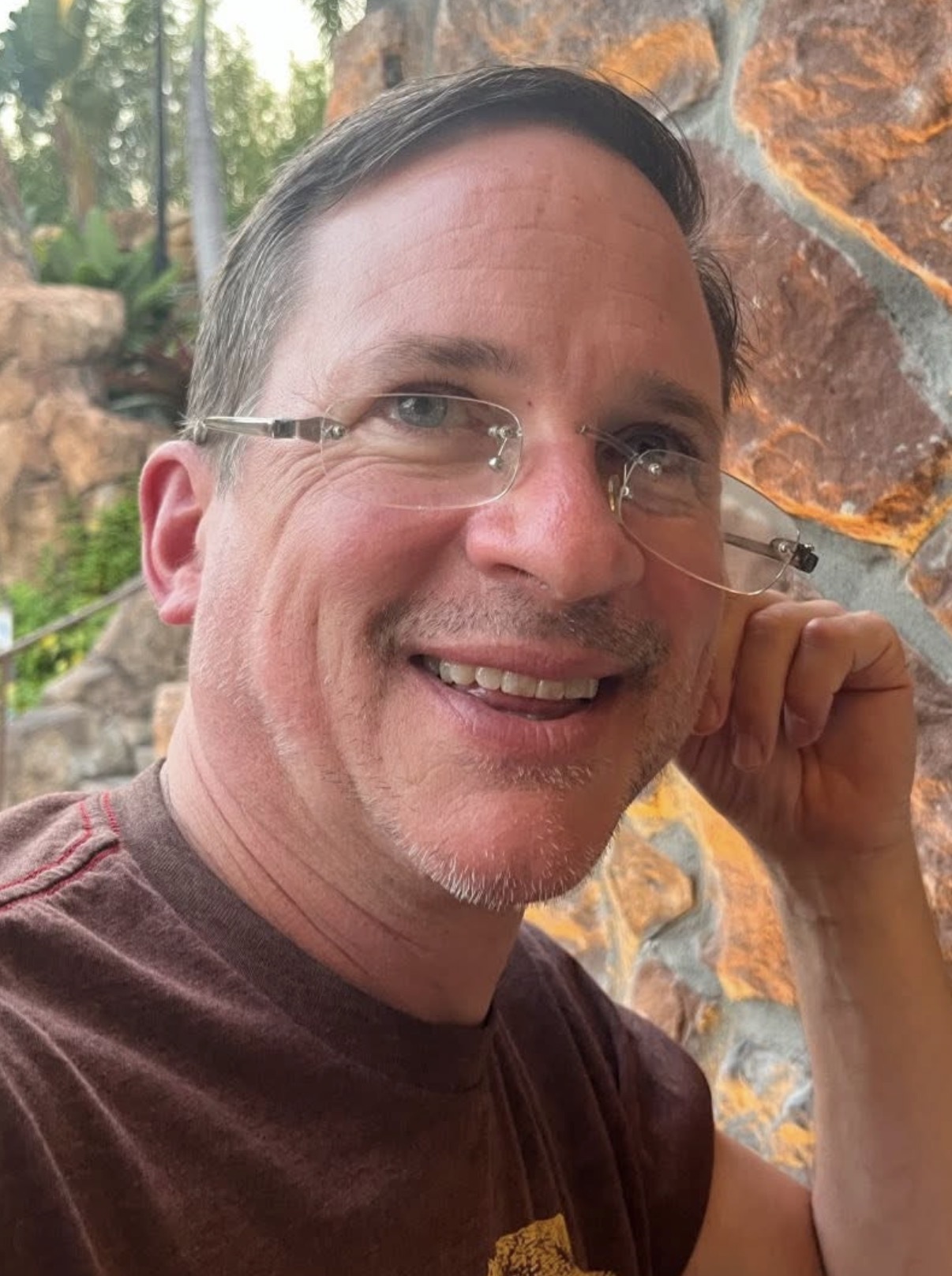 Scott smiling outdoors